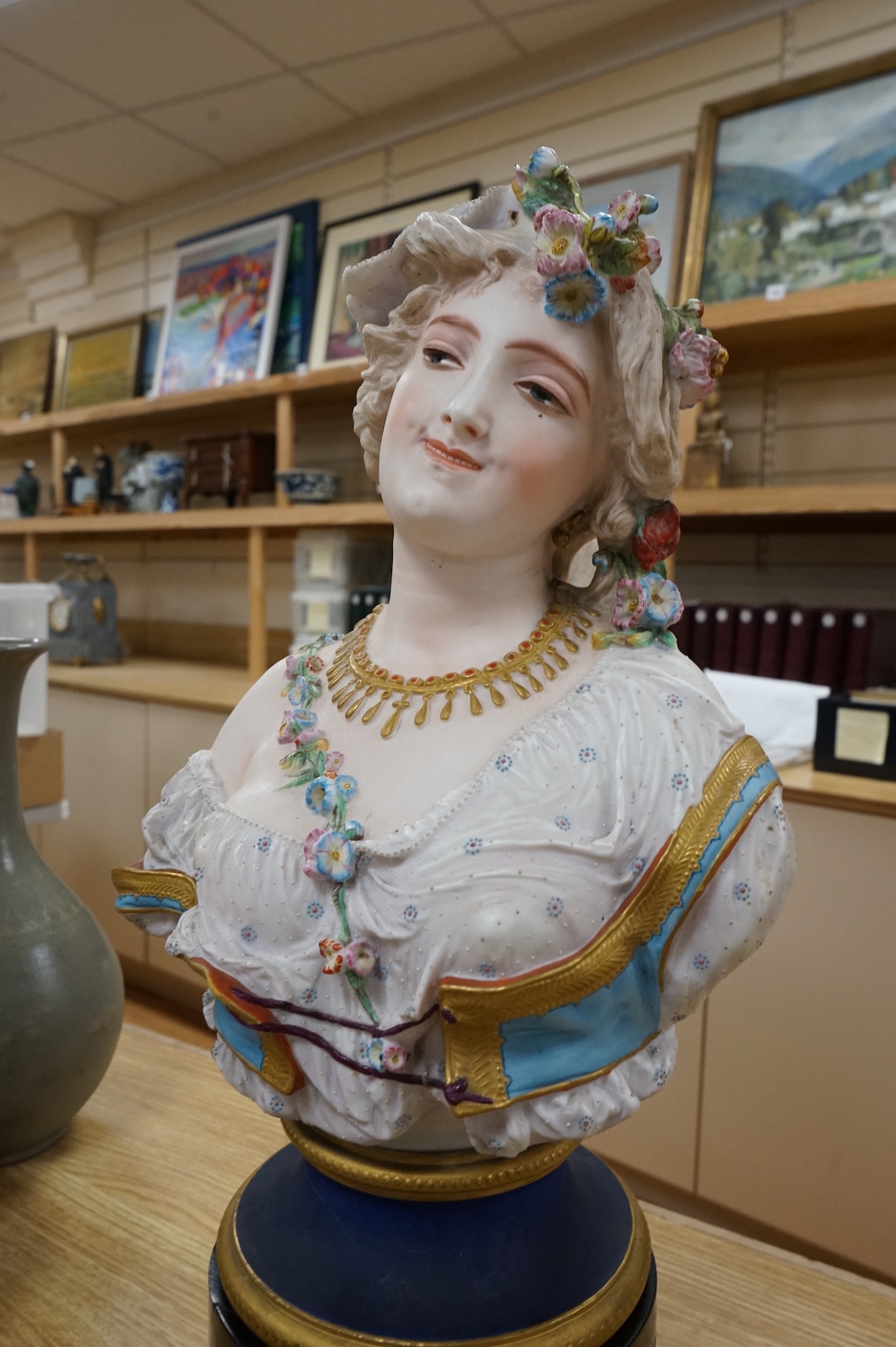 A Paris painted biscuit porcelain bust of a woman, stamped L&M, 50cm